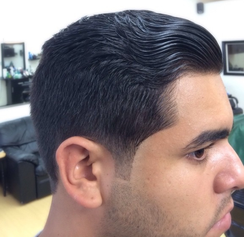 Side fade with pompadour styling at Showtime Barbershop